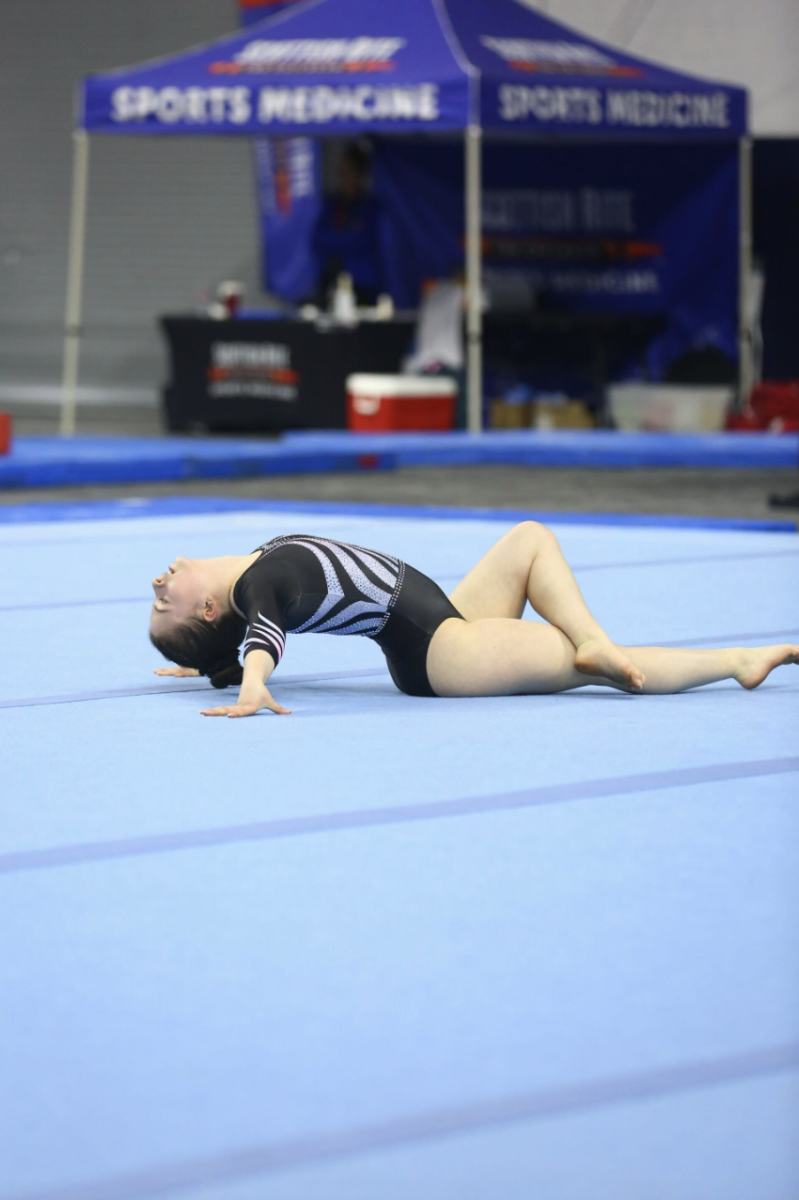 On her floor routine, Sawyer Whitcher poses as part of her choreographed routine. Sawyer is a gymnast for both her club and the school team.